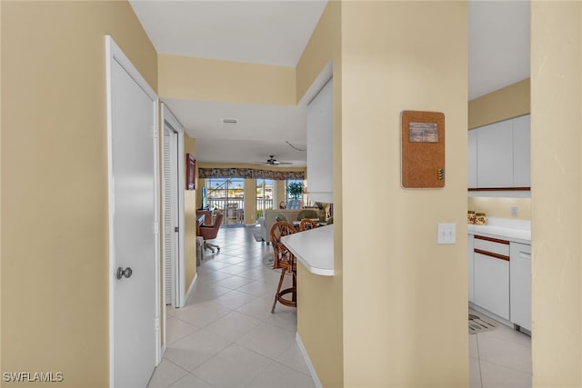 991 N Barfield Dr Unit 110, Marco Island, FL 34145 - hallway featuring light tile patterned floors and baseboards