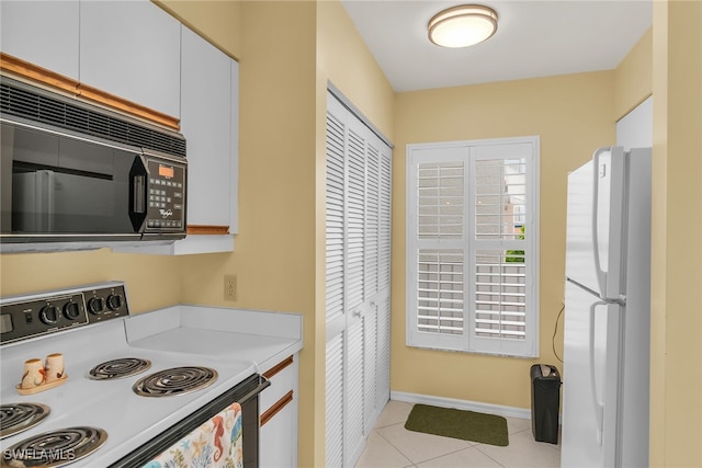 991 N Barfield Dr Unit 110, Marco Island, FL 34145 - kitchen featuring white appliances, light countertops, light tile patterned floors, white cabinetry, and baseboards