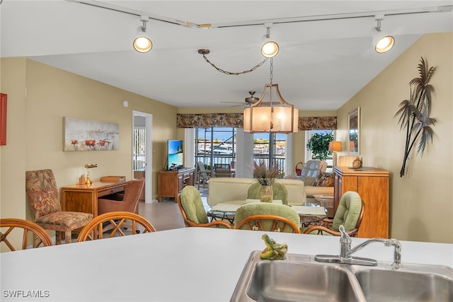 991 N Barfield Dr Unit 110, Marco Island, FL 34145 - kitchen with rail lighting, a sink, and ceiling fan