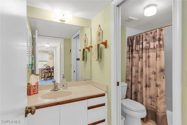 991 N Barfield Dr Unit 110, Marco Island, FL 34145 - bathroom with vanity, toilet, and shower / bathtub combination with curtain