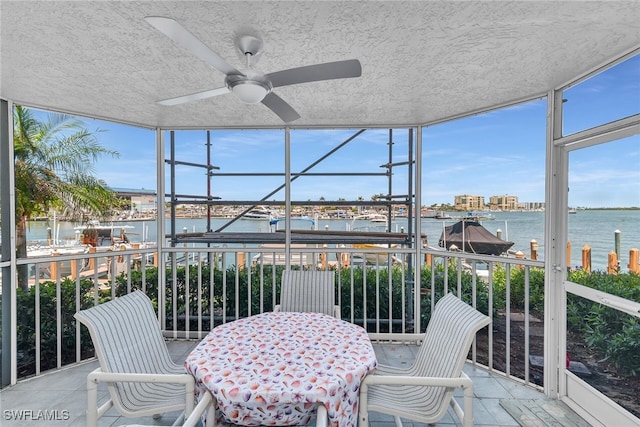 991 N Barfield Dr Unit 110, Marco Island, FL 34145 - sunroom / solarium featuring a water view, a ceiling fan, and plenty of natural light