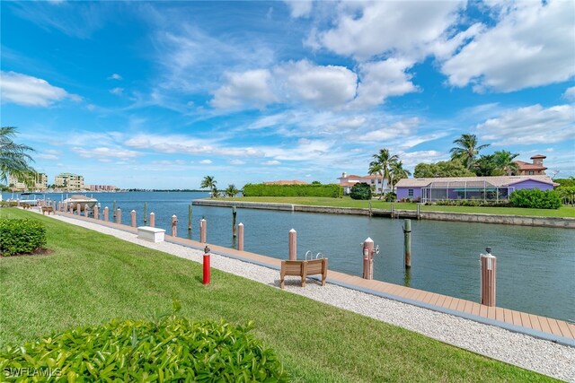 991 N Barfield Dr Unit 110, Marco Island, FL 34145 - dock with a water view and a lawn