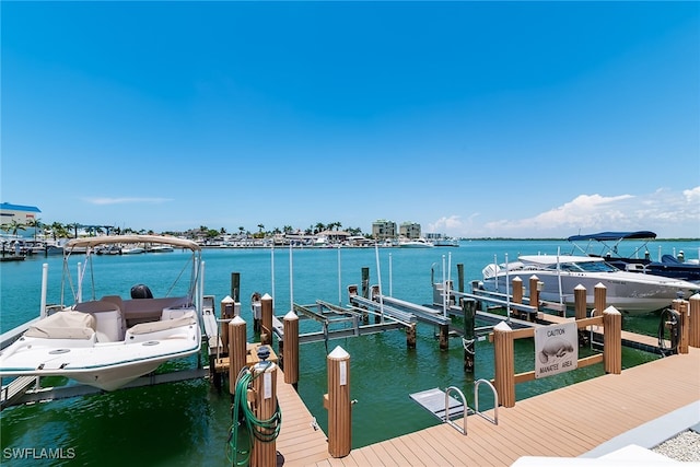 991 N Barfield Dr Unit 110, Marco Island, FL 34145 - dock area with boat lift and a water view