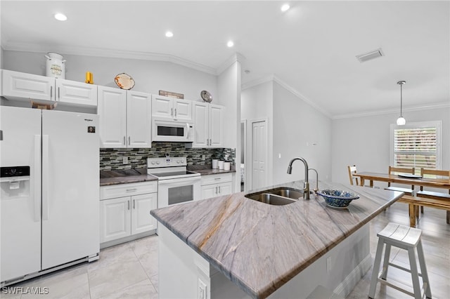1187 16th Ave NE, Naples, FL 34120 - kitchen featuring white appliances, a sink, white cabinetry, tasteful backsplash, and crown molding