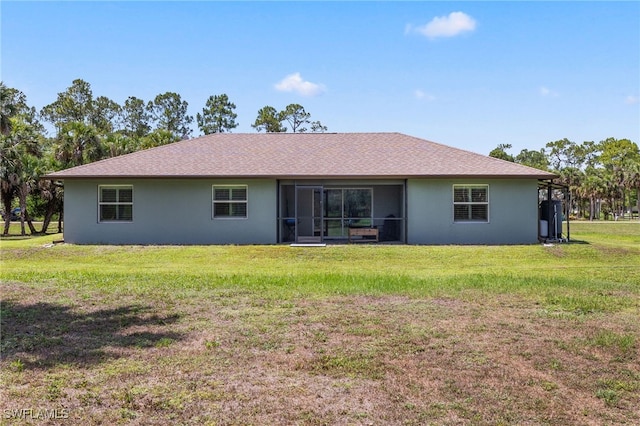 1187 16th Ave NE, Naples, FL 34120 - rear view of house featuring a lawn and stucco siding
