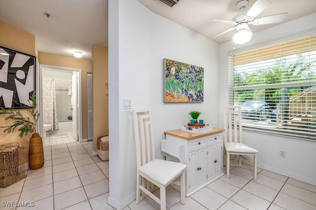 6900 Huntington Lakes Cir Unit 102, Naples, FL 34119 - hall with light tile patterned floors and baseboards