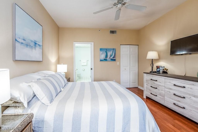6900 Huntington Lakes Cir Unit 102, Naples, FL 34119 - bedroom featuring wood finished floors, ensuite bathroom, a closet, and a ceiling fan