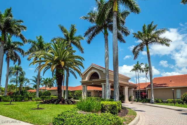 6900 Huntington Lakes Cir Unit 102, Naples, FL 34119 - view of building exterior with driveway