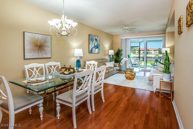 6900 Huntington Lakes Cir Unit 102, Naples, FL 34119 - dining room with wood finished floors, a chandelier, ceiling fan, and baseboards