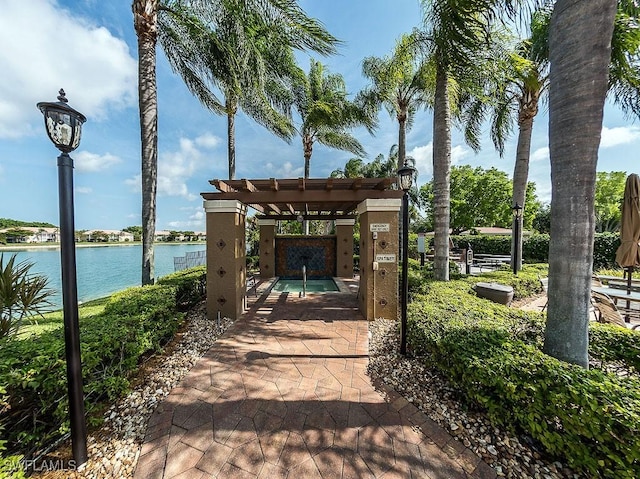 6900 Huntington Lakes Cir Unit 102, Naples, FL 34119 - view of patio / terrace featuring a water view