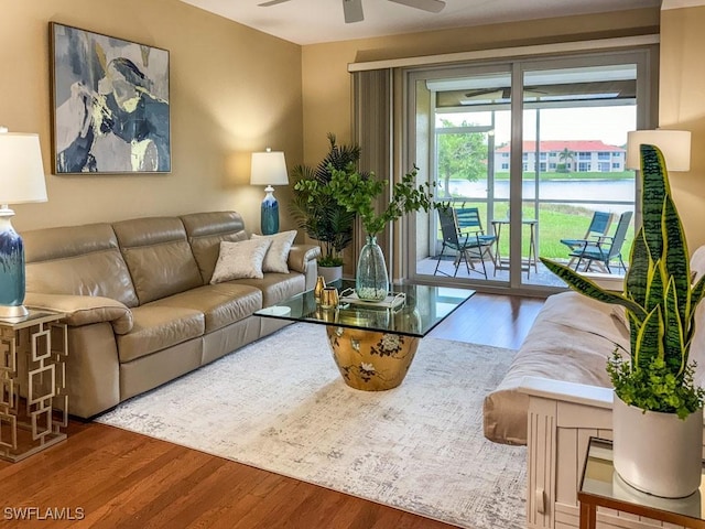 6900 Huntington Lakes Cir Unit 102, Naples, FL 34119 - living area with ceiling fan and wood finished floors