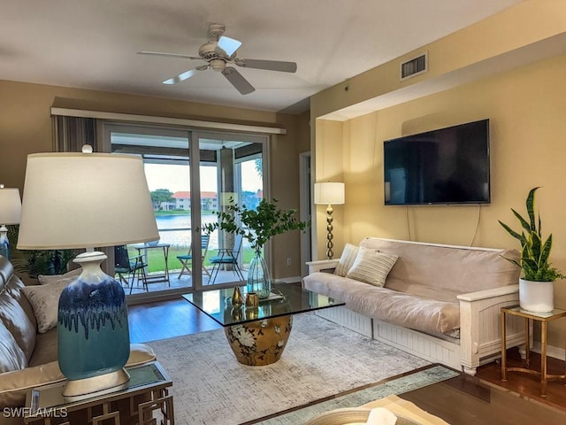 6900 Huntington Lakes Cir Unit 102, Naples, FL 34119 - living room with wood finished floors and ceiling fan