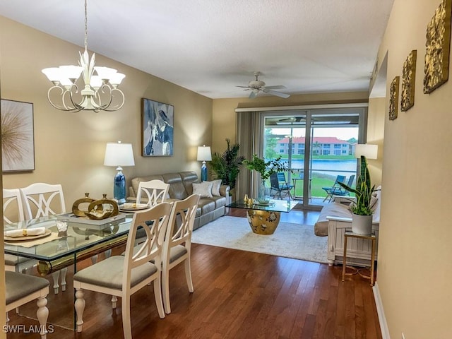 6900 Huntington Lakes Cir Unit 102, Naples, FL 34119 - dining area with wood finished floors, ceiling fan, and a chandelier