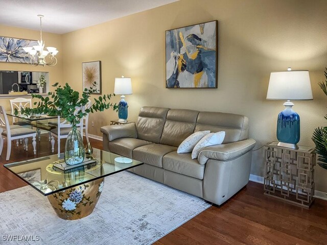 6900 Huntington Lakes Cir Unit 102, Naples, FL 34119 - living area featuring wood finished floors and a chandelier
