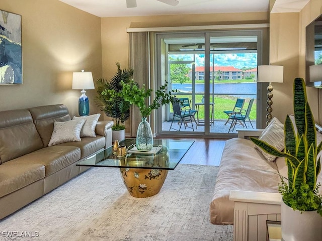 6900 Huntington Lakes Cir Unit 102, Naples, FL 34119 - living room featuring wood finished floors and a ceiling fan