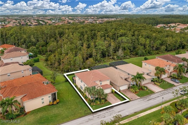 10212 Mimosa Silk Dr, Fort Myers, FL 33913 - aerial perspective of suburban area featuring a forest and property boundaries highlighted