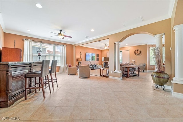 10212 Mimosa Silk Dr, Fort Myers, FL 33913 - dining space with ornate columns, a ceiling fan, plenty of natural light, ornamental molding, and arched walkways