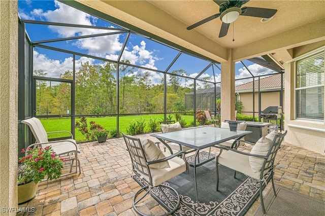 10212 Mimosa Silk Dr, Fort Myers, FL 33913 - view of patio / terrace with outdoor dining space, a ceiling fan, glass enclosure, and a grill