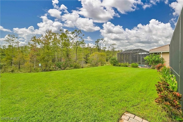10212 Mimosa Silk Dr, Fort Myers, FL 33913 - view of green lawn featuring a lanai