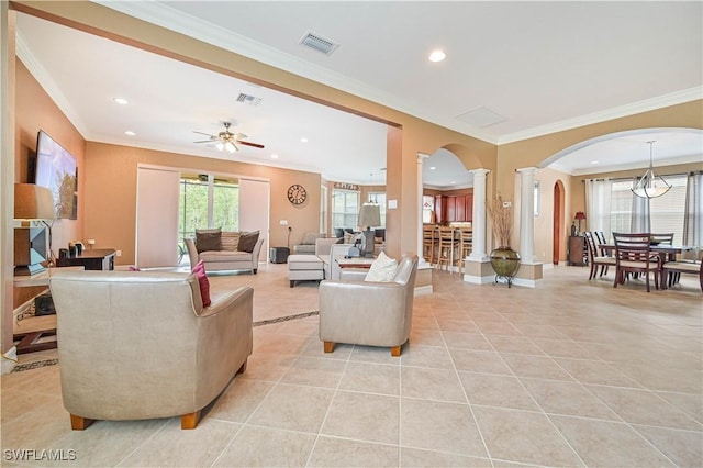 10212 Mimosa Silk Dr, Fort Myers, FL 33913 - living area featuring decorative columns, arched walkways, ornamental molding, light tile patterned flooring, and recessed lighting