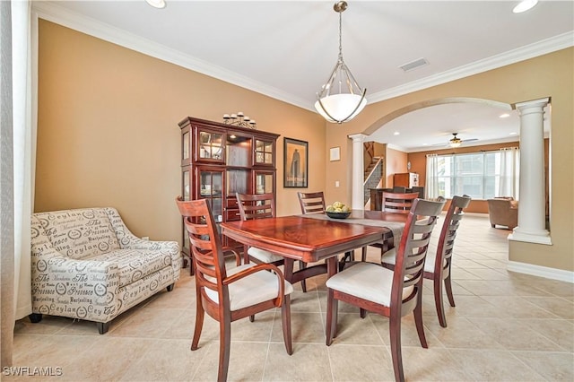 10212 Mimosa Silk Dr, Fort Myers, FL 33913 - dining area featuring ornate columns, light tile patterned flooring, crown molding, arched walkways, and baseboards