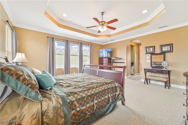 10212 Mimosa Silk Dr, Fort Myers, FL 33913 - bedroom with arched walkways, a raised ceiling, crown molding, carpet floors, and baseboards