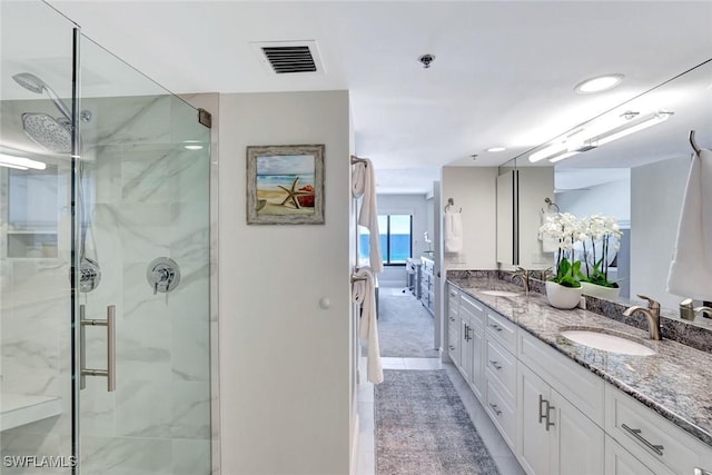 100 N Collier Blvd Unit 1002, Marco Island, FL 34145 - ensuite bathroom with a marble finish shower and double vanity