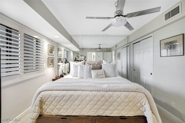 100 N Collier Blvd Unit 1002, Marco Island, FL 34145 - carpeted bedroom featuring baseboards, ceiling fan, and two closets