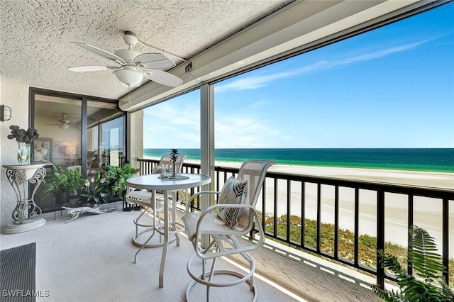 100 N Collier Blvd Unit 1002, Marco Island, FL 34145 - balcony with ceiling fan, view of water and beach, and a sunroom