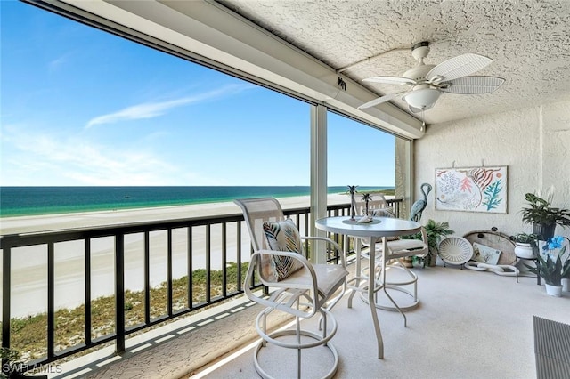 100 N Collier Blvd Unit 1002, Marco Island, FL 34145 - balcony featuring view of water and beach and a ceiling fan