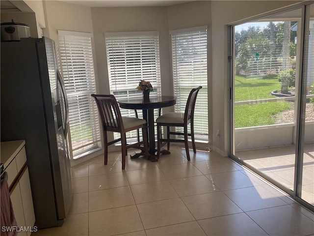 14598 Sagamore Ct, Fort Myers, FL 33908 - dining space featuring plenty of natural light, light tile patterned floors, and baseboards