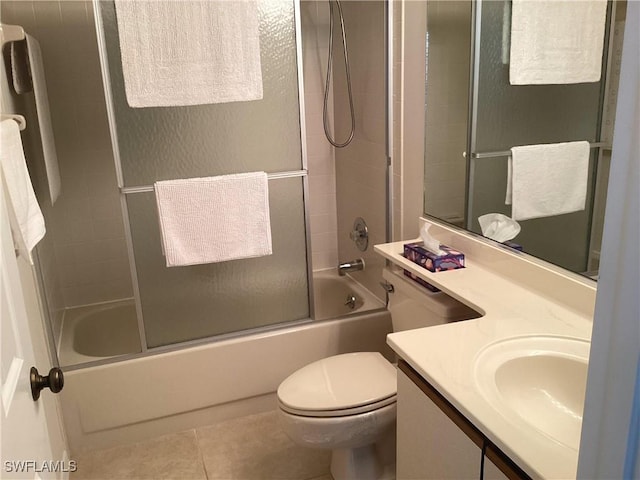 14598 Sagamore Ct, Fort Myers, FL 33908 - full bathroom with combined bath / shower with glass door, toilet, vanity, and tile patterned floors