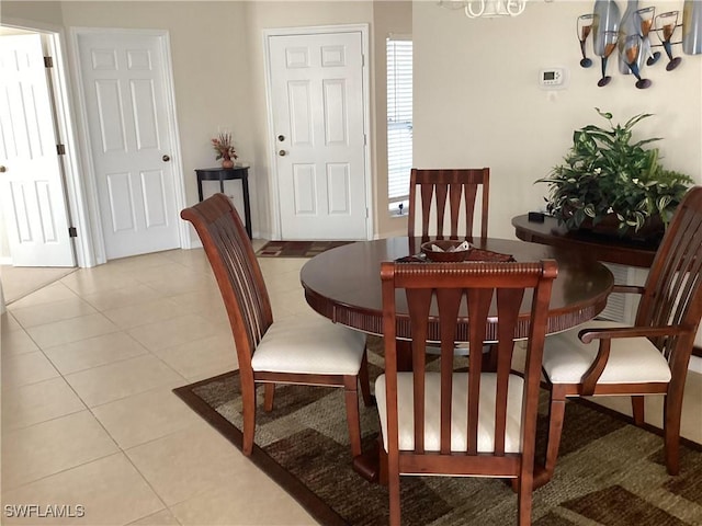 14598 Sagamore Ct, Fort Myers, FL 33908 - dining room featuring a chandelier and light tile patterned floors