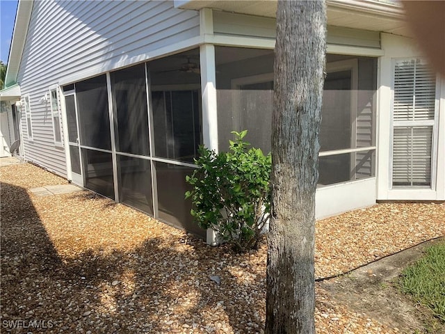 14598 Sagamore Ct, Fort Myers, FL 33908 - view of property exterior featuring a sunroom