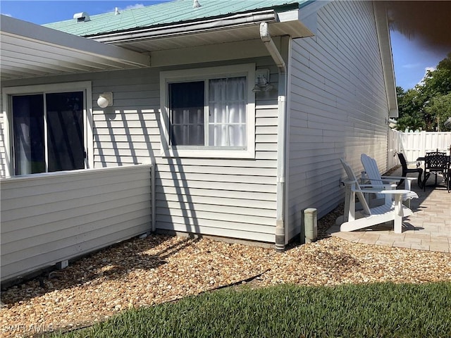 14598 Sagamore Ct, Fort Myers, FL 33908 - view of property exterior featuring a patio area and outdoor dining area