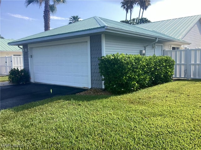 14598 Sagamore Ct, Fort Myers, FL 33908 - view of property exterior featuring asphalt driveway and metal roof