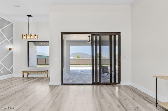 224 NW 14th Pl, Cape Coral, FL 33993 - unfurnished dining area with wood finished floors and baseboards