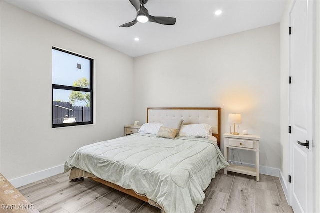 224 NW 14th Pl, Cape Coral, FL 33993 - bedroom with light wood finished floors, baseboards, recessed lighting, and ceiling fan
