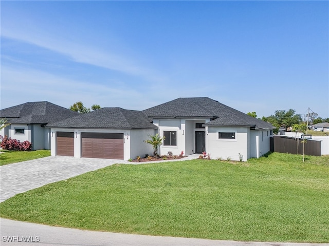 224 NW 14th Pl, Cape Coral, FL 33993 - view of front of property with an attached garage, stucco siding, decorative driveway, and a shingled roof