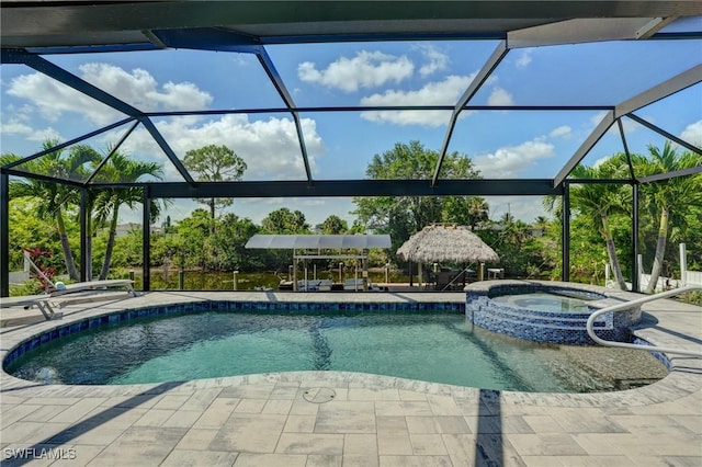 2142 NE 27th Ter, Cape Coral, FL 33909 - view of pool with a patio, a pool with connected hot tub, and glass enclosure