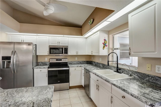 2142 NE 27th Ter, Cape Coral, FL 33909 - kitchen featuring appliances with stainless steel finishes, a sink, a ceiling fan, white cabinetry, and vaulted ceiling