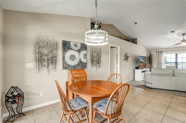 2142 NE 27th Ter, Cape Coral, FL 33909 - dining room featuring vaulted ceiling, light tile patterned floors, baseboards, and a ceiling fan