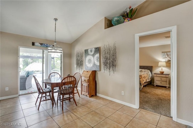 2142 NE 27th Ter, Cape Coral, FL 33909 - dining room featuring lofted ceiling, baseboards, and light tile patterned flooring