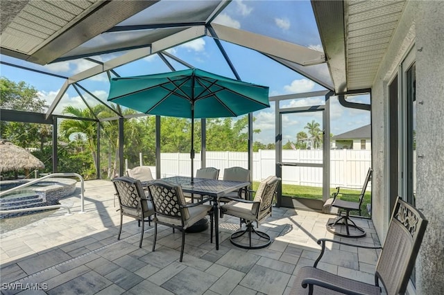2142 NE 27th Ter, Cape Coral, FL 33909 - view of patio featuring an outdoor hot tub, outdoor dining space, and a lanai