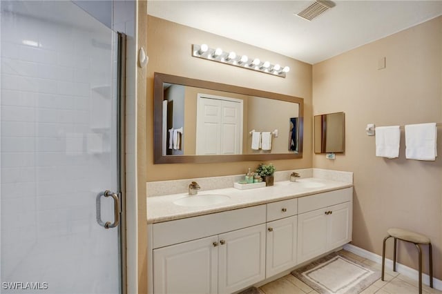2142 NE 27th Ter, Cape Coral, FL 33909 - full bath with a stall shower, double vanity, baseboards, and tile patterned floors