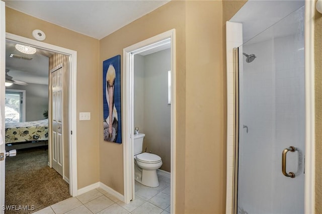 2142 NE 27th Ter, Cape Coral, FL 33909 - ensuite bathroom with a shower stall, toilet, tile patterned floors, and baseboards