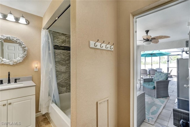 2142 NE 27th Ter, Cape Coral, FL 33909 - full bath featuring ceiling fan, vanity, shower / bath combination with curtain, and tile patterned flooring