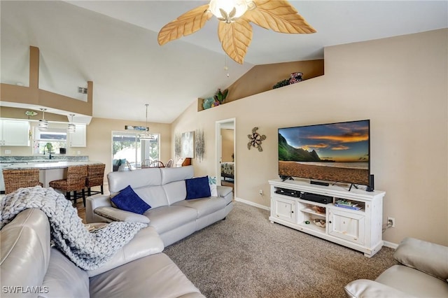 2142 NE 27th Ter, Cape Coral, FL 33909 - living room with a ceiling fan, baseboards, light colored carpet, and high vaulted ceiling