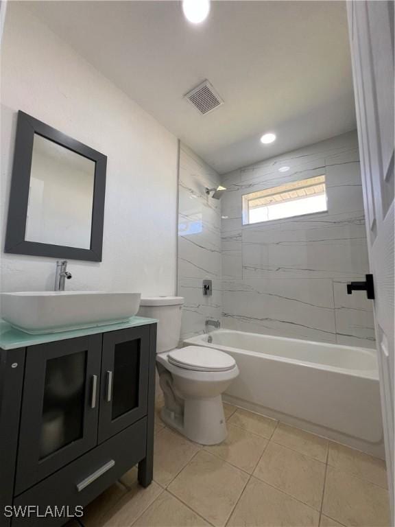 1412/1414 W 12th St, Lehigh Acres, FL 33972 - bathroom featuring vanity, toilet, bathing tub / shower combination, tile patterned flooring, and recessed lighting