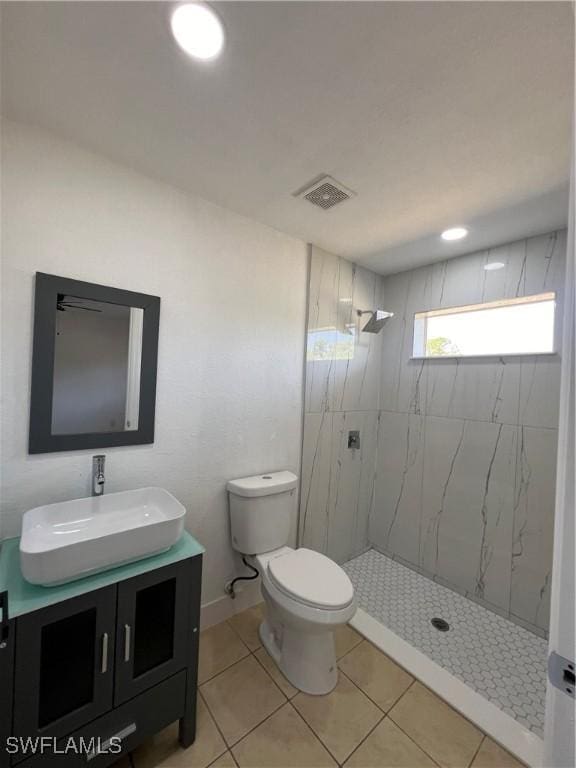 1412/1414 W 12th St, Lehigh Acres, FL 33972 - bathroom with vanity, a shower stall, toilet, and tile patterned flooring